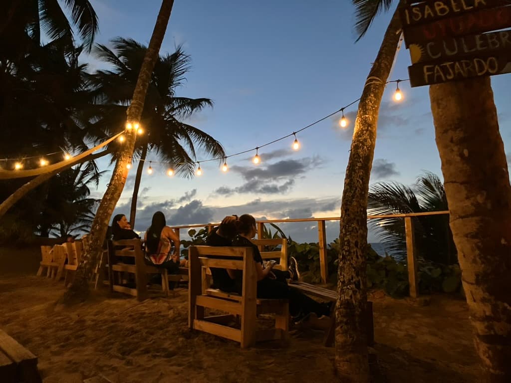 Locals at an open-air beach bar