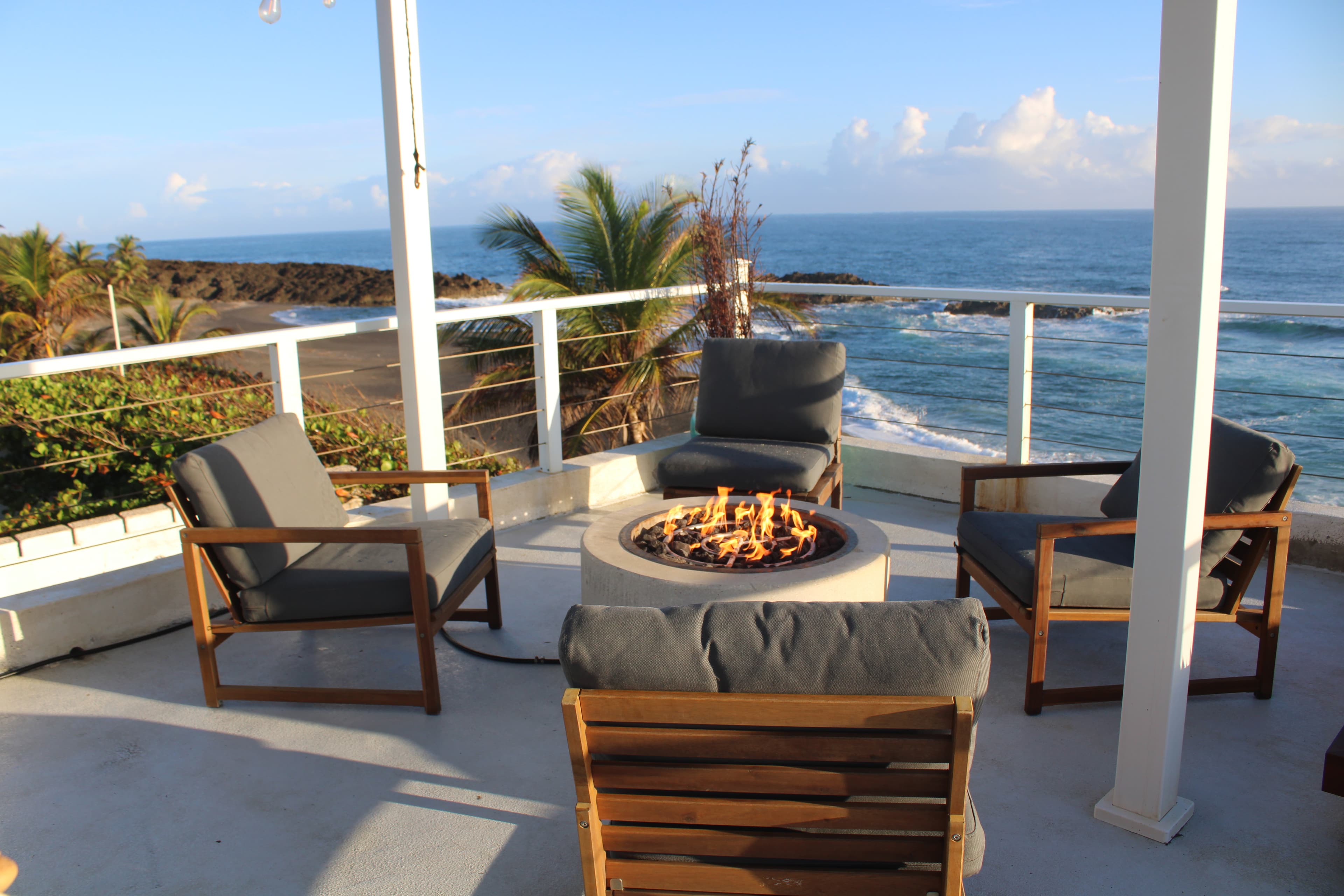 Fire pit at sunset with ocean views at Arenas Negra