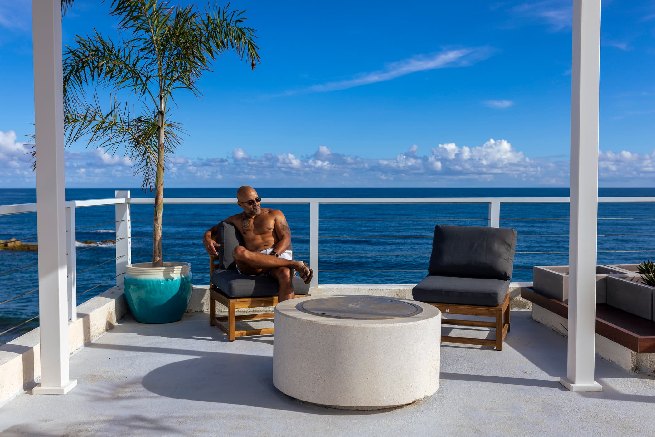 Person lounging on the rooftop at Arenas Negra