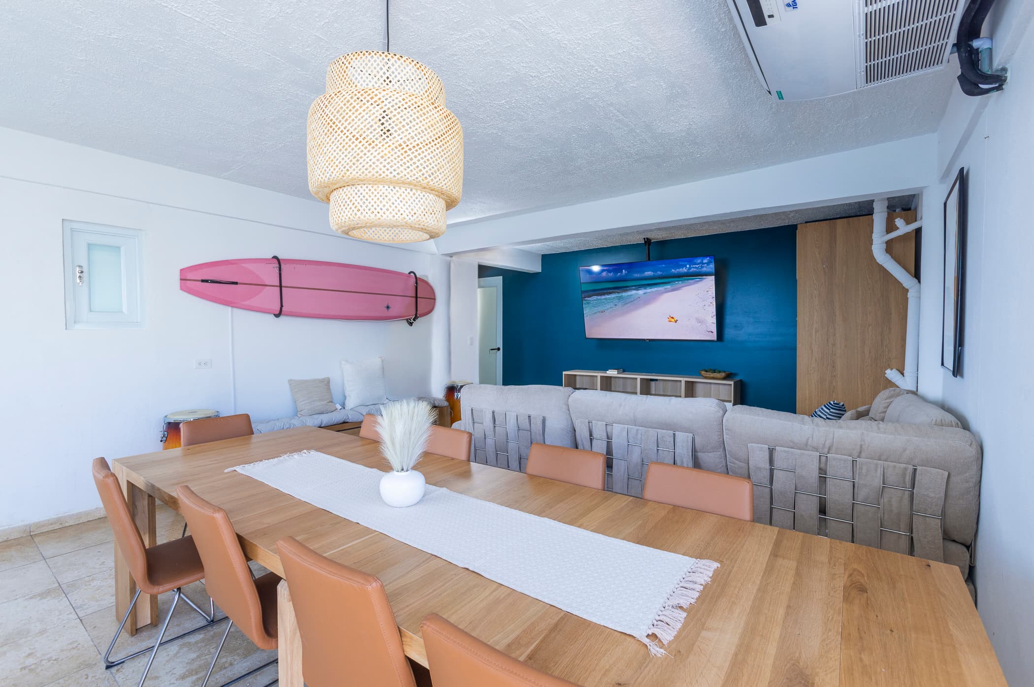 Living and dining area flowing out to the pool deck