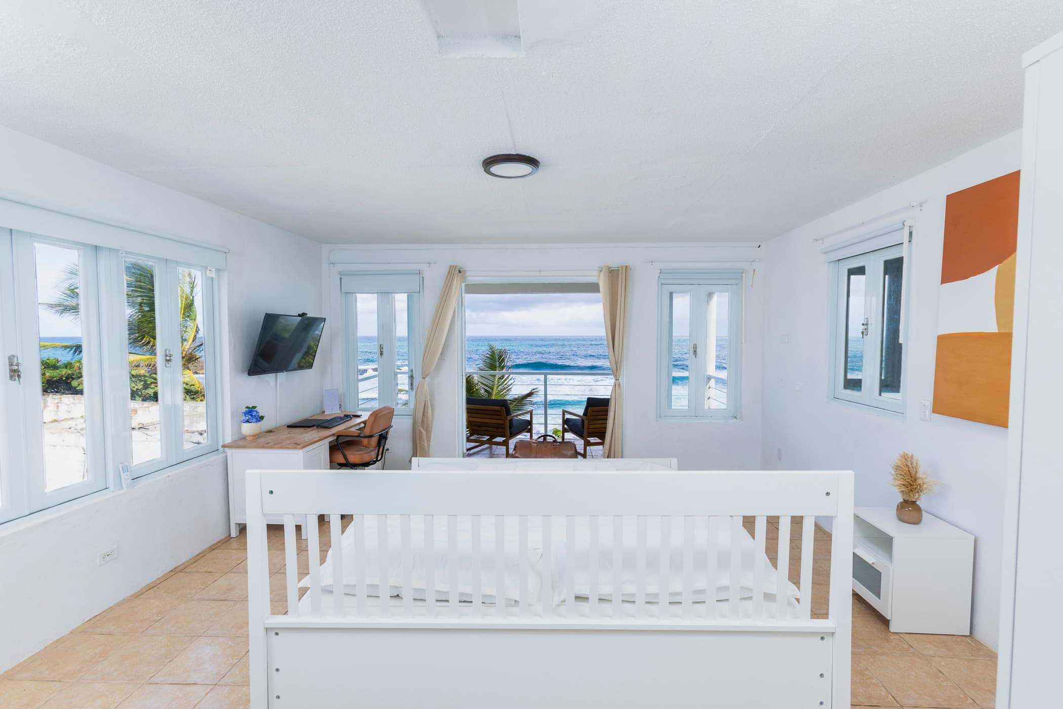Master suite with bed and full ocean view