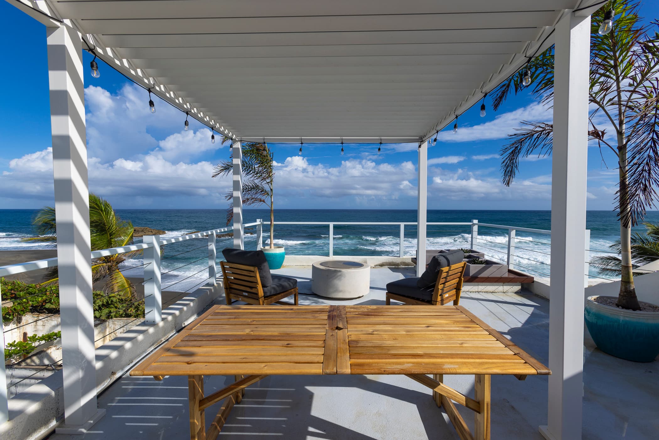 Rooftop pergola lounge with ocean views